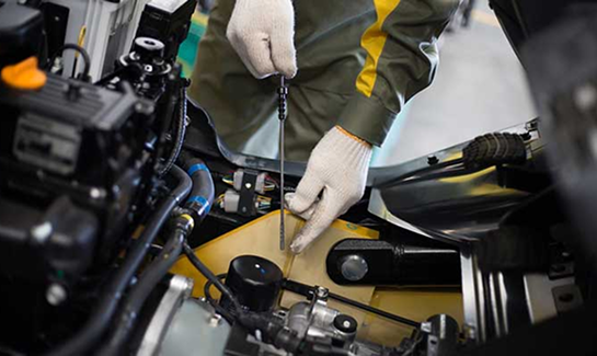Mechanic working on a vehicle's engine